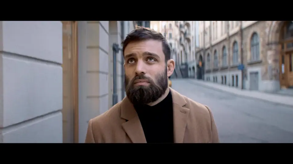 Bearded man in a camel coat on a Stockholm street, from the Beard and Hair Trimming Kit film
