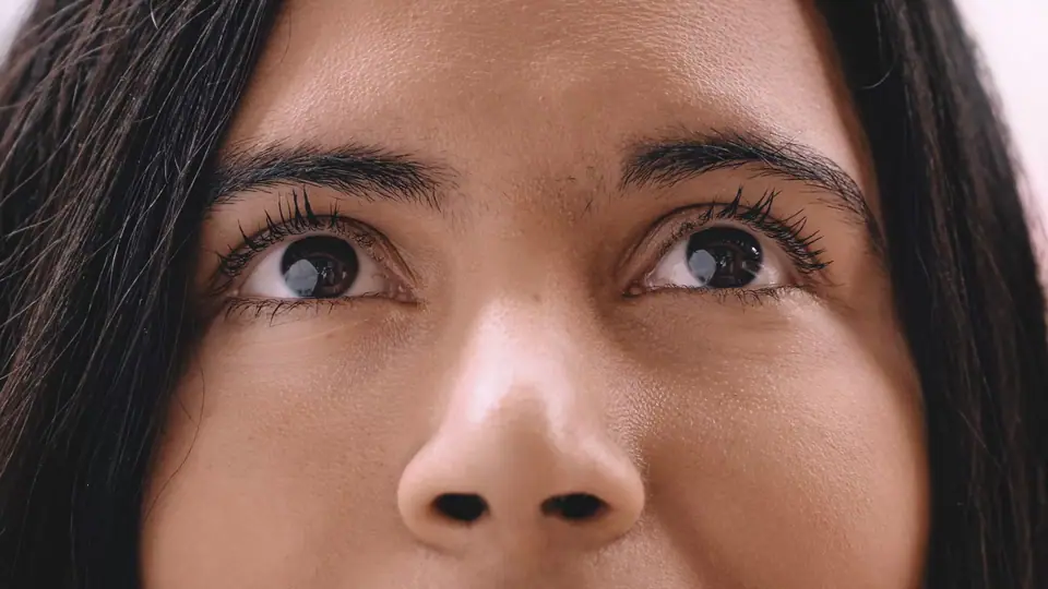 Extreme close-up of a woman's eyes looking up