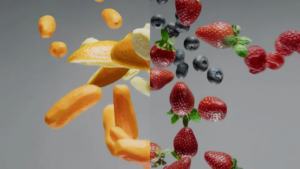 Strawberries, blueberries and mango flying through the air