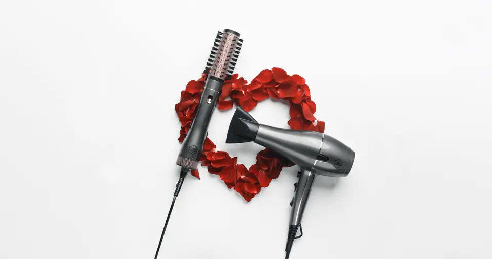 Keratin Care hair dryer and styler framed by a heart of red roses