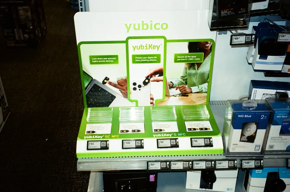 YubiKey in-store display at Best Buy with green retail packaging on the shelf