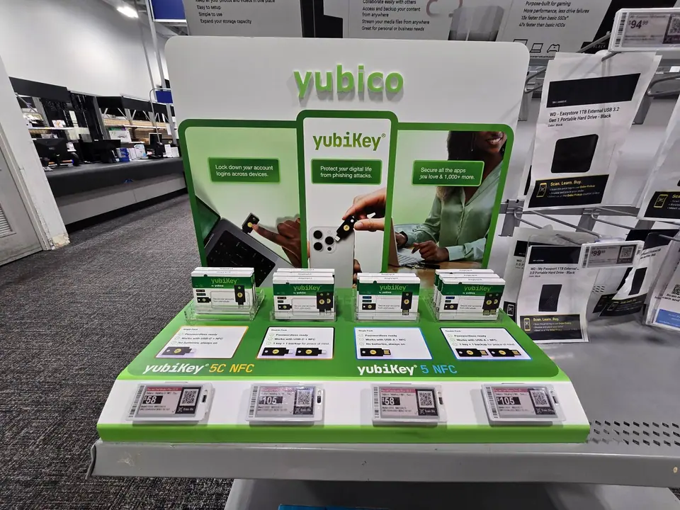 The YubiKey display at Best Buy head-on: YubiKey 5C NFC and 5 NFC boxes in single and two-packs, each above a card listing its benefits