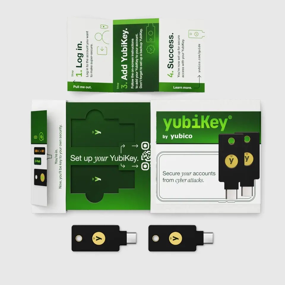 Open YubiKey 5C NFC two-pack: the tray marked 'Set up your YubiKey', a fold-out with numbered setup steps, and both keys laid out below